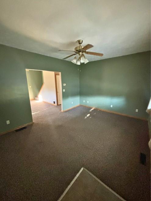 966 West Ridge Avenue Sharpsville, PA 16150 - Photo 4 of 17 en empty room with windows and fan