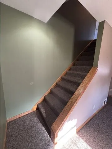 a large kitchen with a stove a refrigerator and a sink