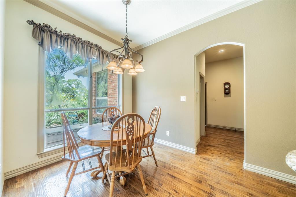 109 Overton Ridge Circle Weatherford, TX 76088 - Photo 6 of 27 Breakfast Dining - wood flooring an windows to brighten the home.
