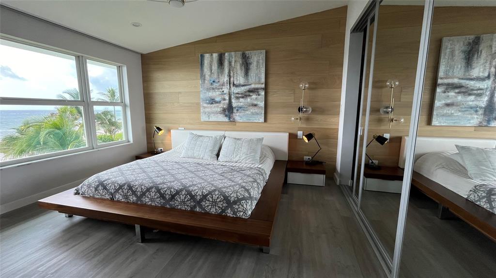 1041 Hillsboro Mile, Unit 3 Hillsboro Beach, FL 33062 - Photo 11 of 22 a bedroom with a bed and a window