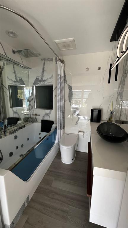 1041 Hillsboro Mile, Unit 3 Hillsboro Beach, FL 33062 - Photo 14 of 22 a living room with furniture a flat screen tv and a view of kitchen