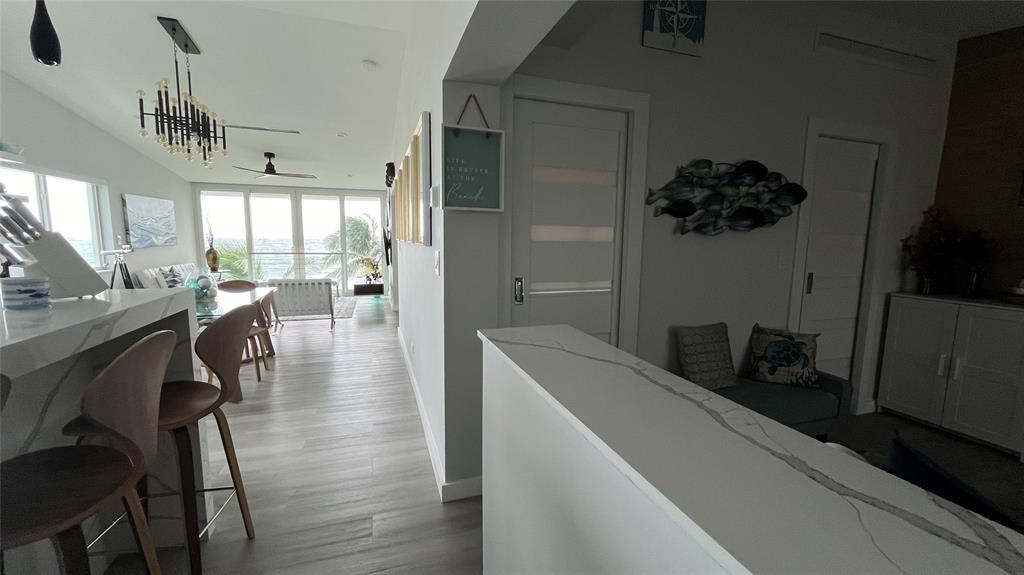 1041 Hillsboro Mile, Unit 3 Hillsboro Beach, FL 33062 - Photo 16 of 22 a view of a dining room with furniture window and wooden floor