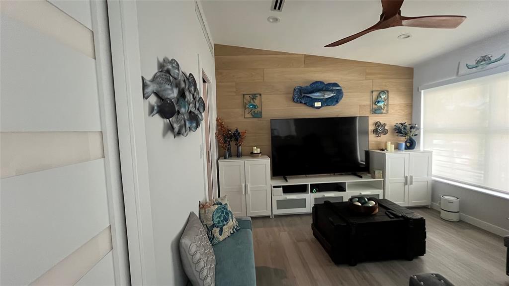 1041 Hillsboro Mile, Unit 3 Hillsboro Beach, FL 33062 - Photo 17 of 22 a living room with furniture and a flat screen tv