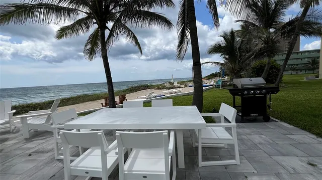 a view of a patio with swimming pool