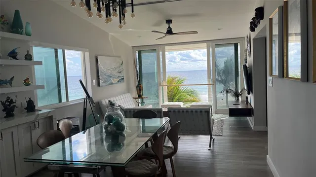 a view of a dining room with furniture window and wooden floor