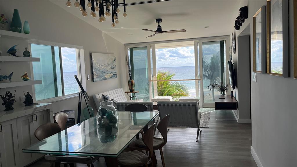 1041 Hillsboro Mile, Unit 3 Hillsboro Beach, FL 33062 - Photo 4 of 22 a view of a dining room with furniture window and wooden floor