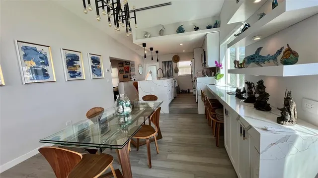 a kitchen with stainless steel appliances kitchen island granite countertop lots of counter top space