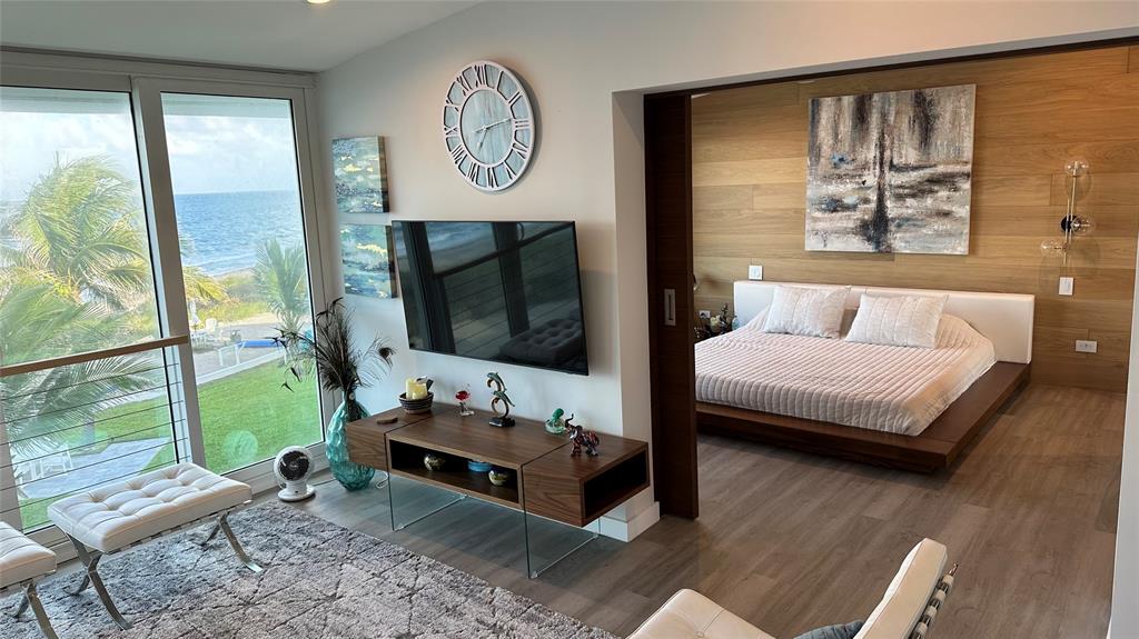 1041 Hillsboro Mile, Unit 3 Hillsboro Beach, FL 33062 - Photo 10 of 22 a living room with furniture and a flat screen tv