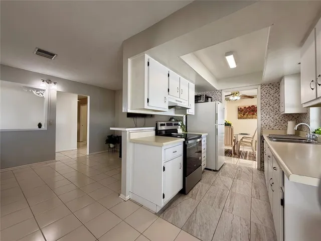 a kitchen with cabinets appliances and cabinets