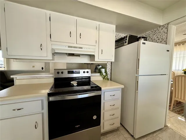 a kitchen with a sink and a window