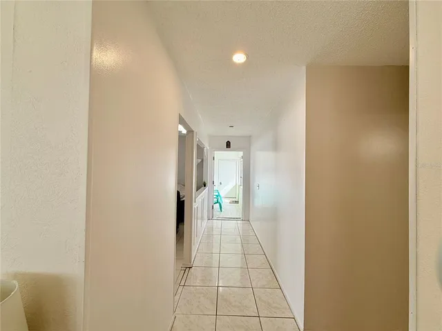 a spacious bedroom with a bed and window