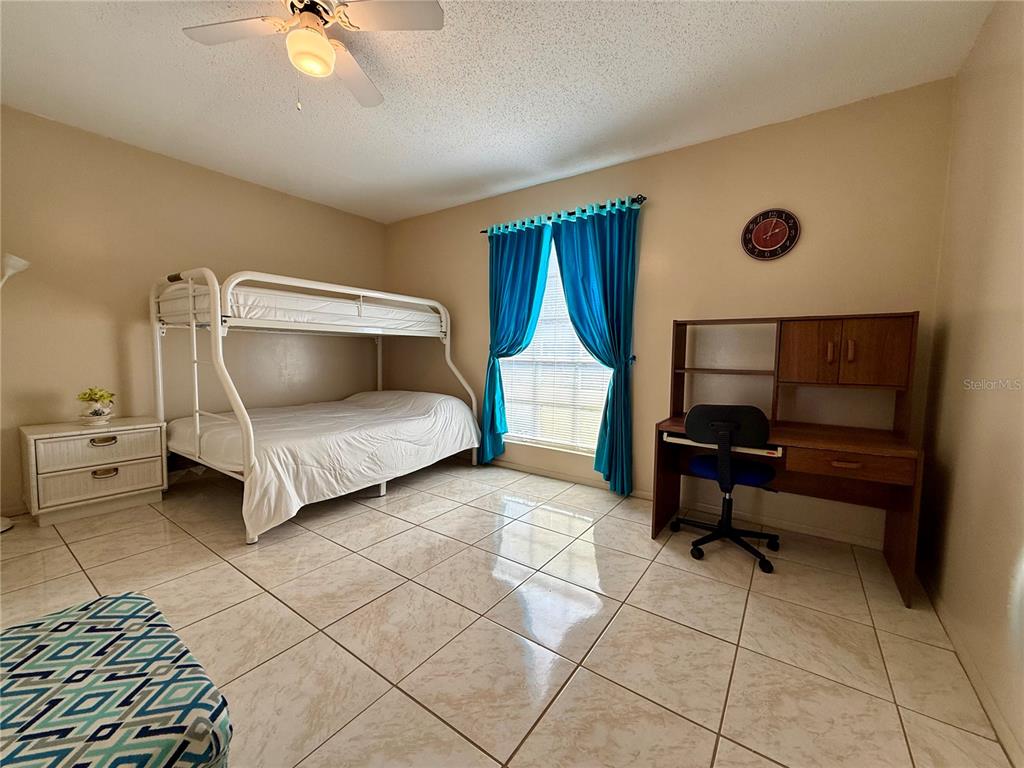 13508 Santa Rosa Avenue Port Charlotte, FL 33981 - Photo 22 of 30 a living room with furniture and a lamp