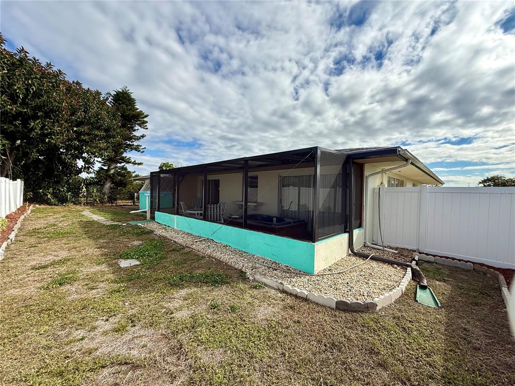 13508 Santa Rosa Avenue Port Charlotte, FL 33981 - Photo 25 of 30 a backyard of a house with lots of green space