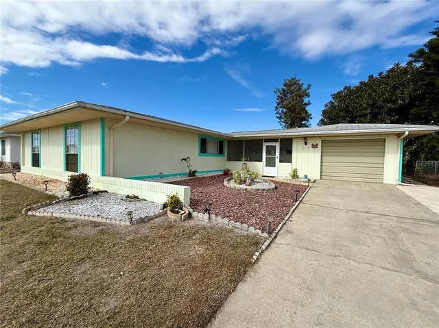 a house with trees in the background