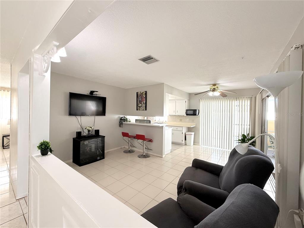 13508 Santa Rosa Avenue Port Charlotte, FL 33981 - Photo 7 of 30 a living room with furniture and a flat screen tv