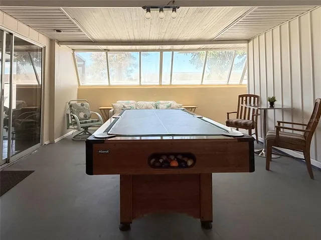 a kitchen with stainless steel appliances granite countertop a refrigerator oven a sink dishwasher and white cabinets with wooden floor