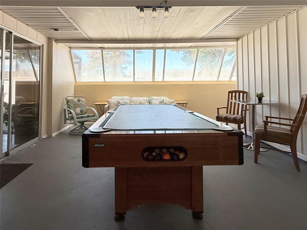 13508 Santa Rosa Avenue Port Charlotte, FL 33981 - Photo 10 of 30 a living room with a table chairs and a window