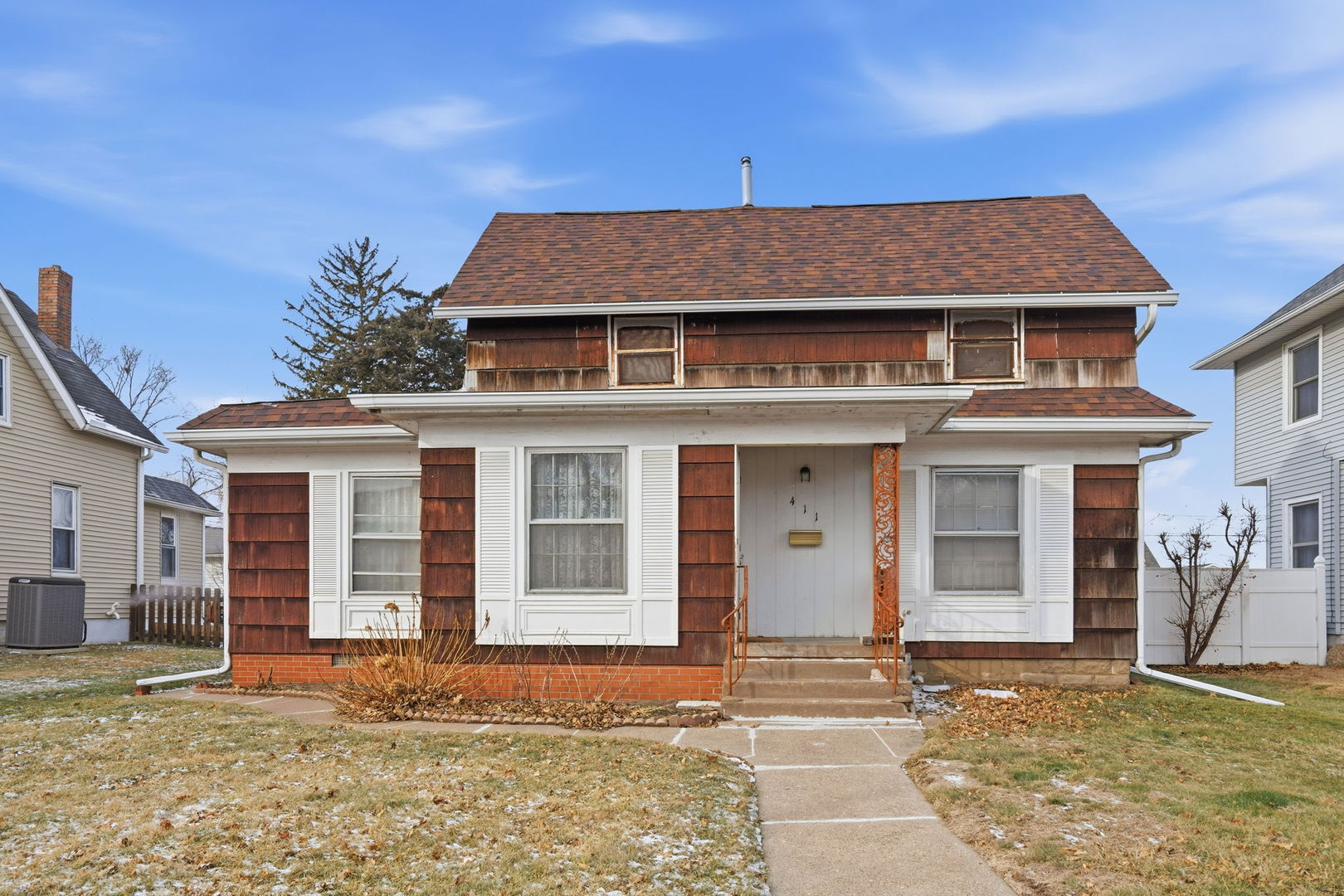 a front view of a house with a yard