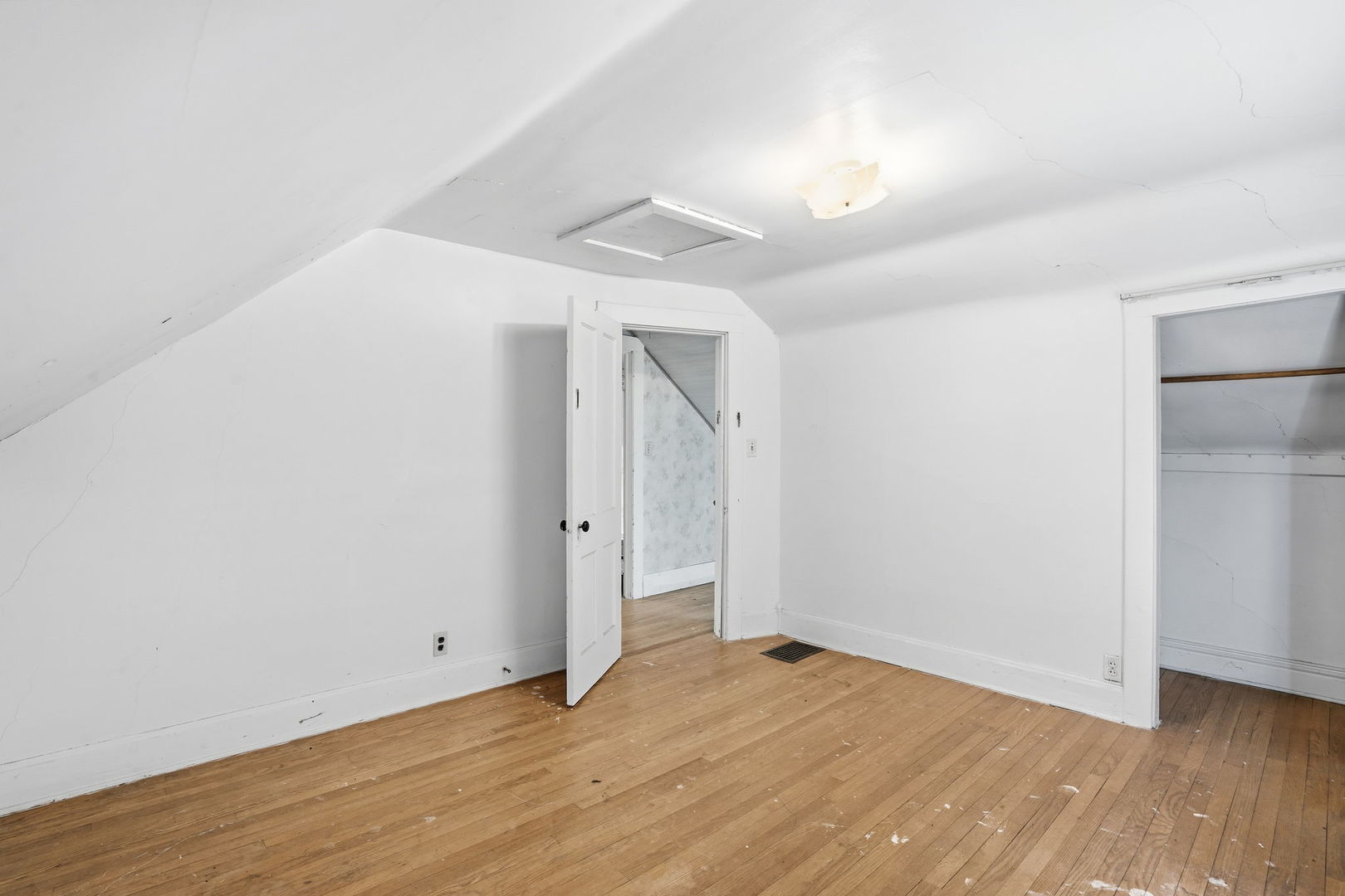 411 39th Street Moline, IL 61265 - Photo 13 of 16 a view of an empty room with wooden floor and a window