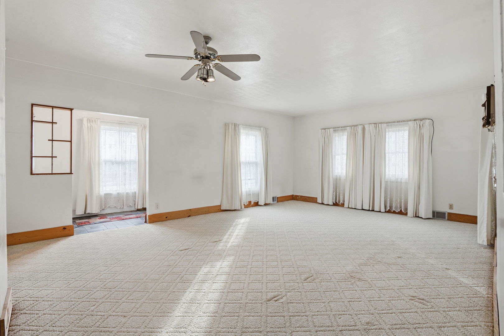 411 39th Street Moline, IL 61265 - Photo 3 of 16 a view of an empty room with a window