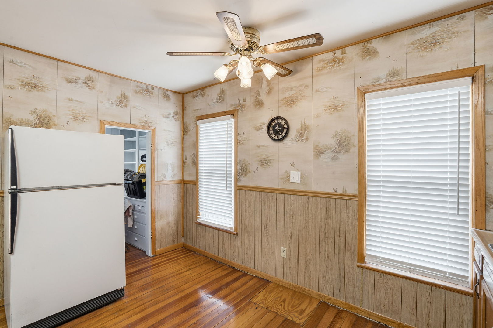 411 39th Street Moline, IL 61265 - Photo 9 of 16 a view of a kitchen with a refrigerator a ceiling fan and a refrigerator