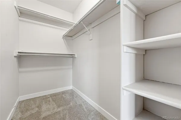 a view of an empty walk in closet