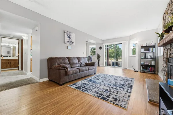 a living room with furniture and a rug