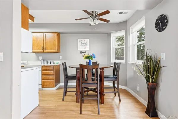a view of a dining room with furniture and wooden floor