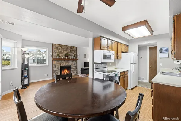 a view of a livingroom with furniture and a fireplace