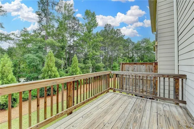 a view of balcony with wooden floor