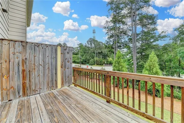 a view of balcony with wooden floor
