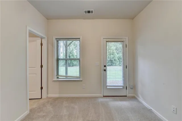 an empty room with windows