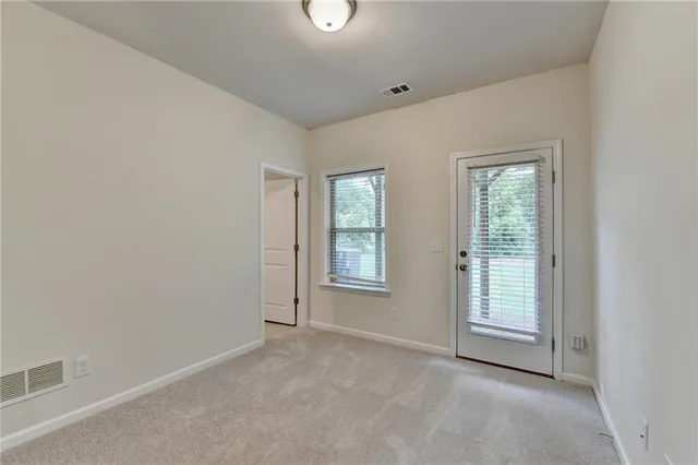 an empty room with windows