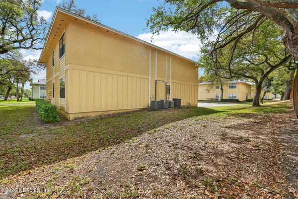 a view of a house with a backyard