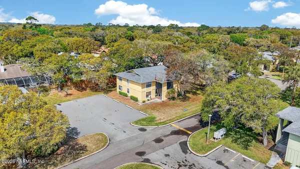 an aerial view of houses with yard