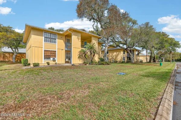 a view of a door with a chair and the door