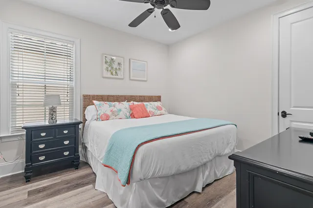 a bedroom with a bed and a table