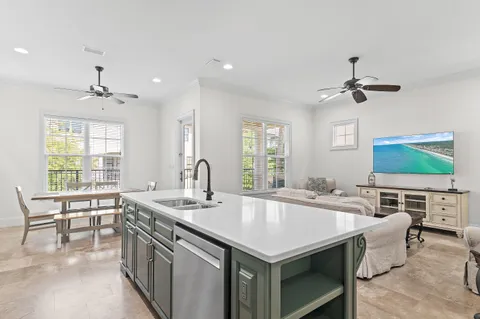 a kitchen with a stove a sink and a refrigerator