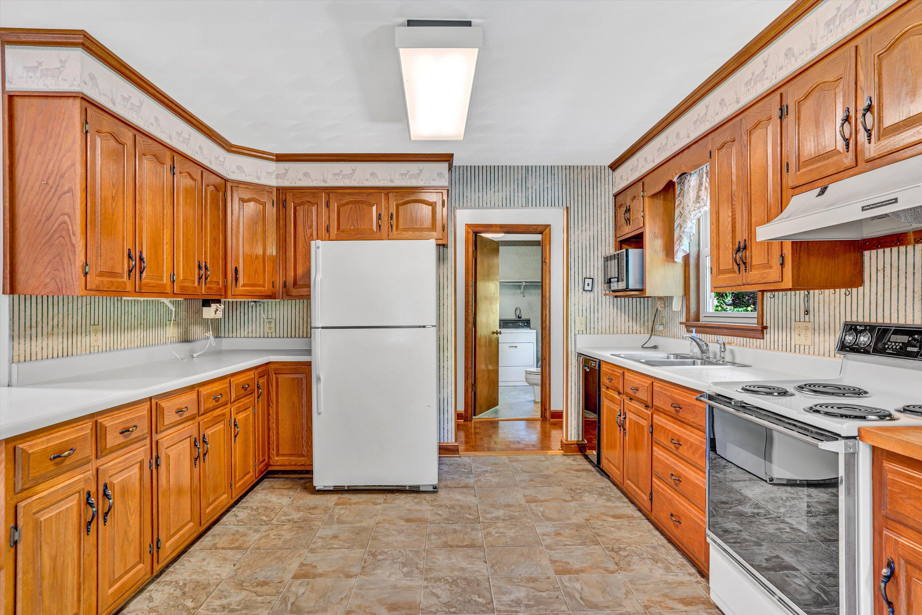 551 Heather Ridge Drive Rocky Mount, VA 24151 - Photo 13 of 41 a kitchen with stainless steel appliances granite countertop a refrigerator a stove and a sink