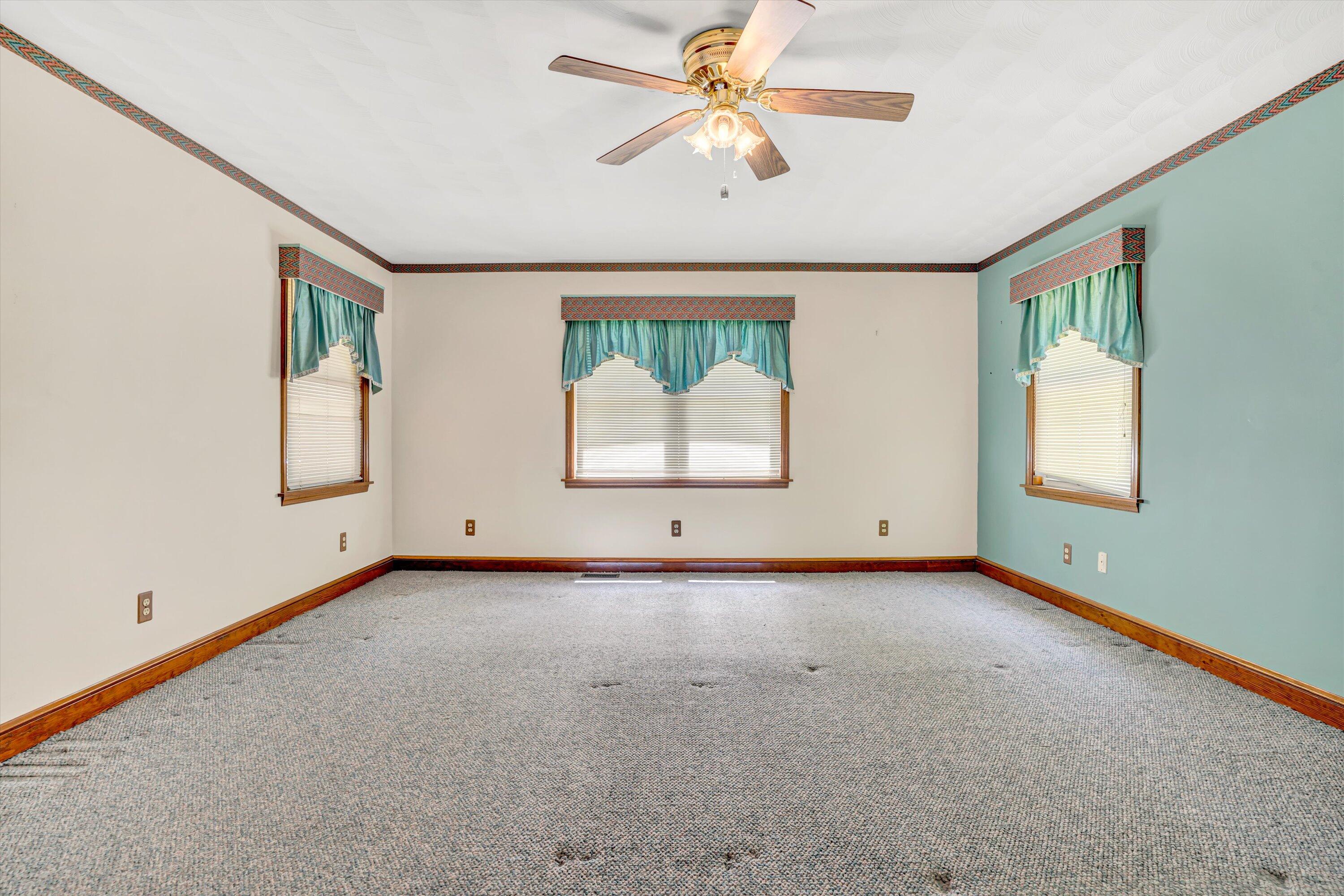 551 Heather Ridge Drive Rocky Mount, VA 24151 - Photo 16 of 41 an empty room with windows and fan