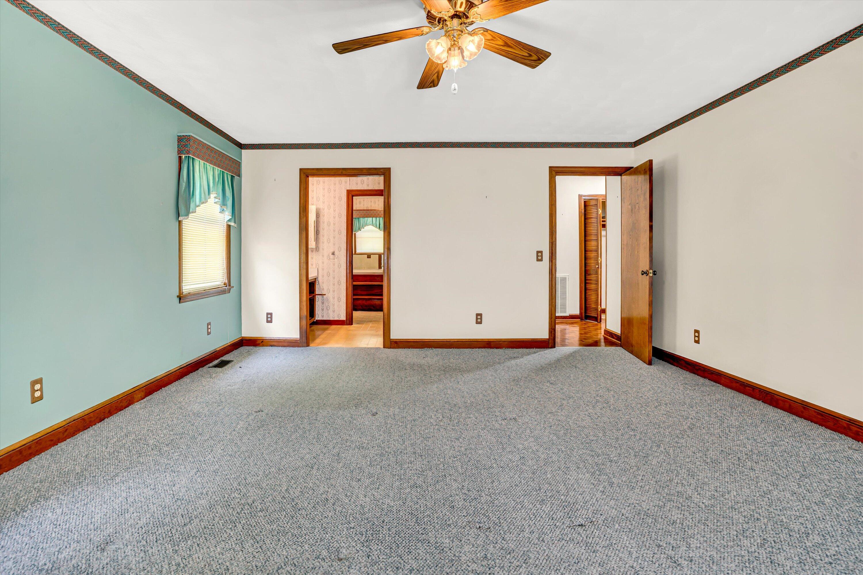 551 Heather Ridge Drive Rocky Mount, VA 24151 - Photo 17 of 41 an empty room with windows and fan