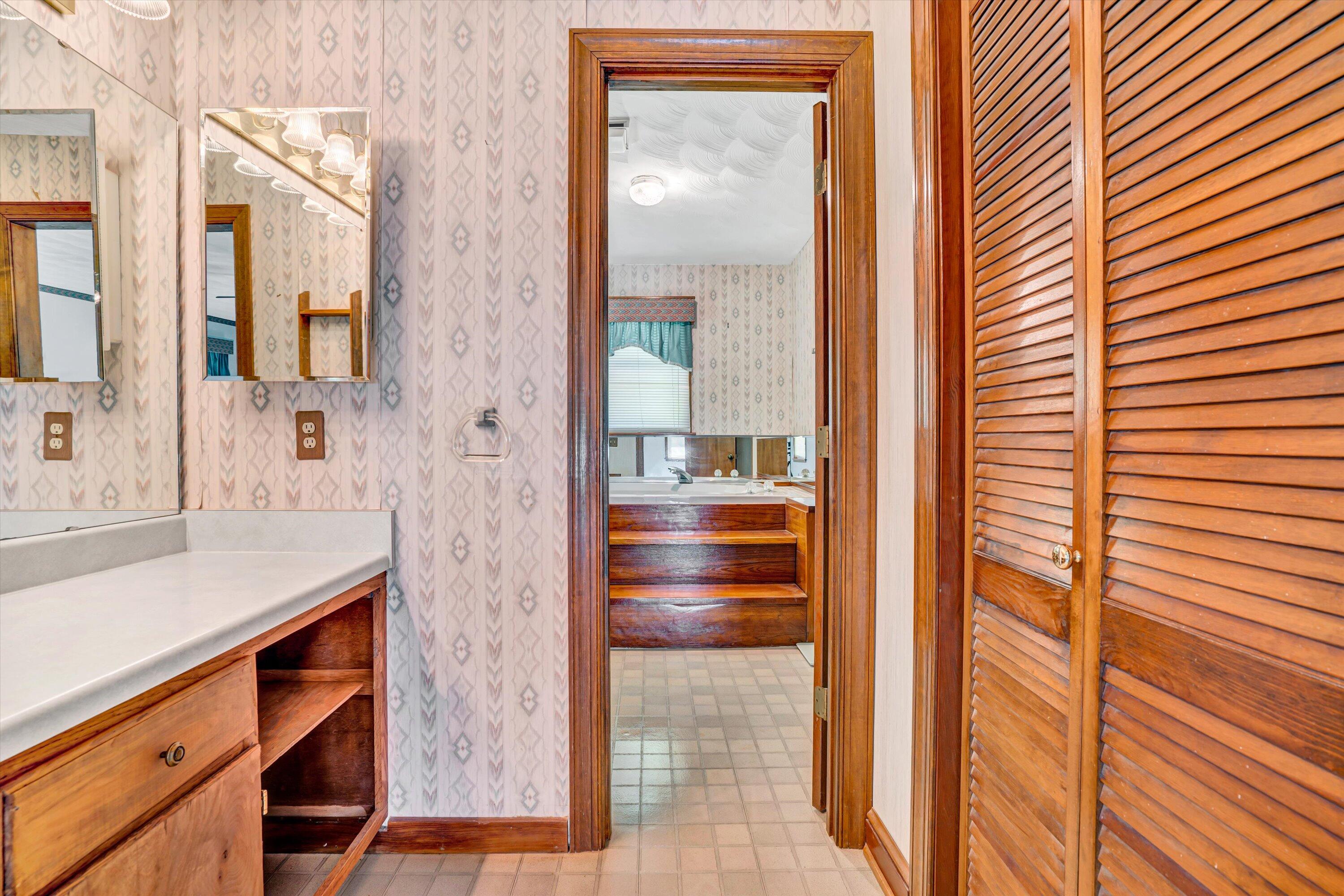 551 Heather Ridge Drive Rocky Mount, VA 24151 - Photo 18 of 41 a bathroom with a sink and a mirror