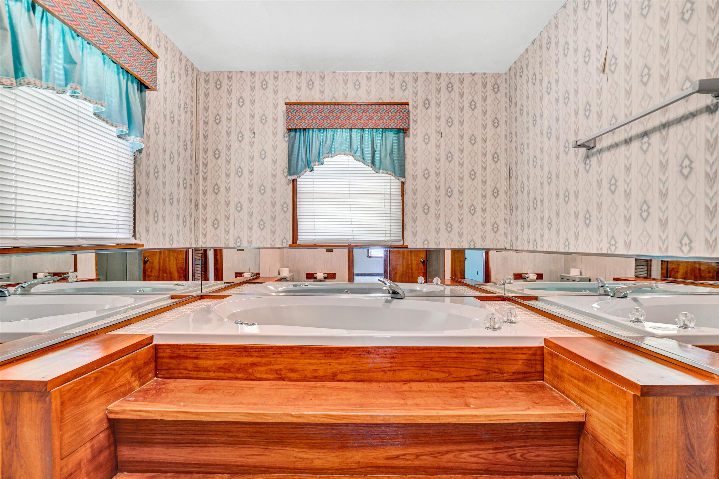 551 Heather Ridge Drive Rocky Mount, VA 24151 - Photo 20 of 41 a bathroom with a granite countertop sink and a bathtub