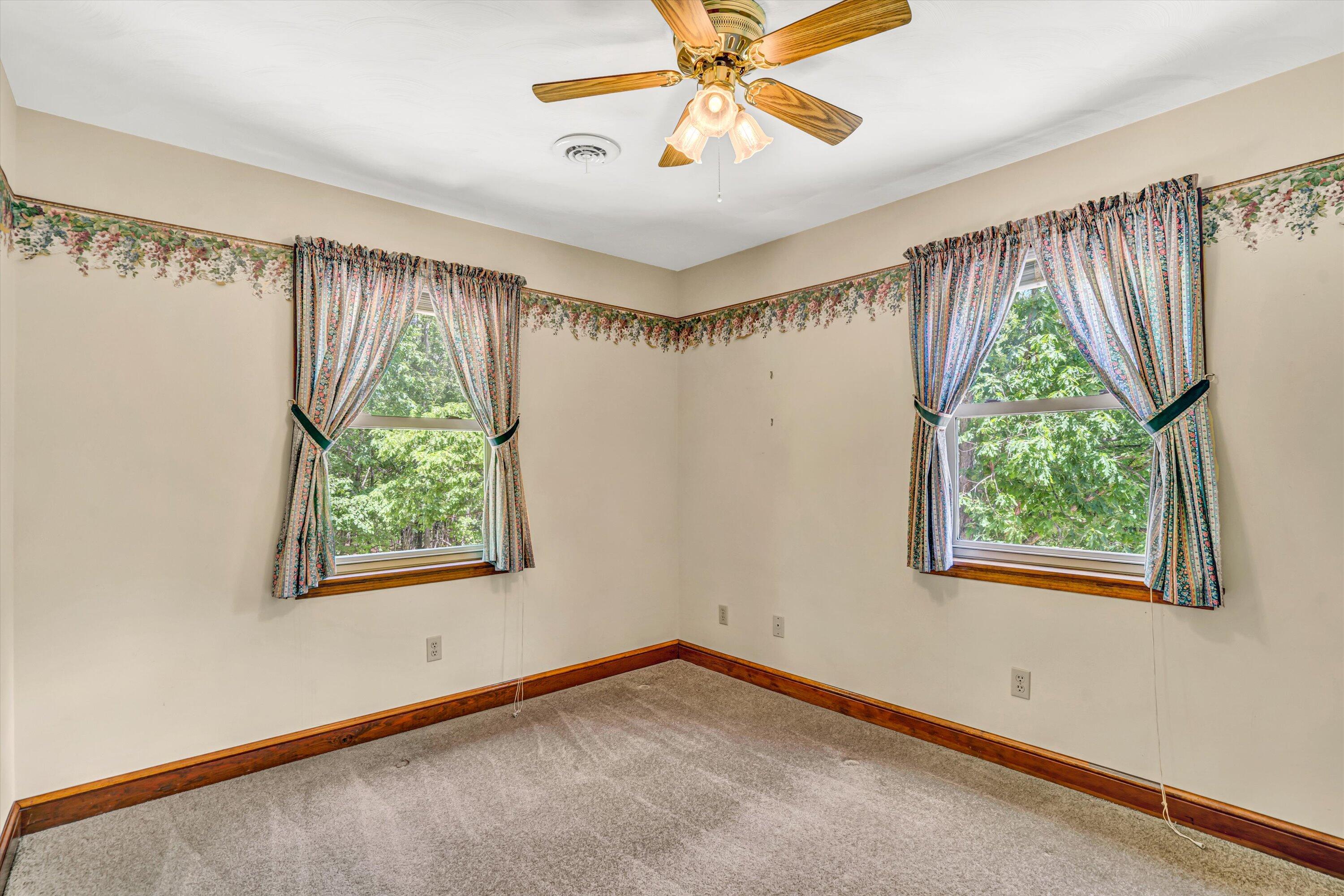 551 Heather Ridge Drive Rocky Mount, VA 24151 - Photo 26 of 41 a view of a big room with window and a ceiling fan