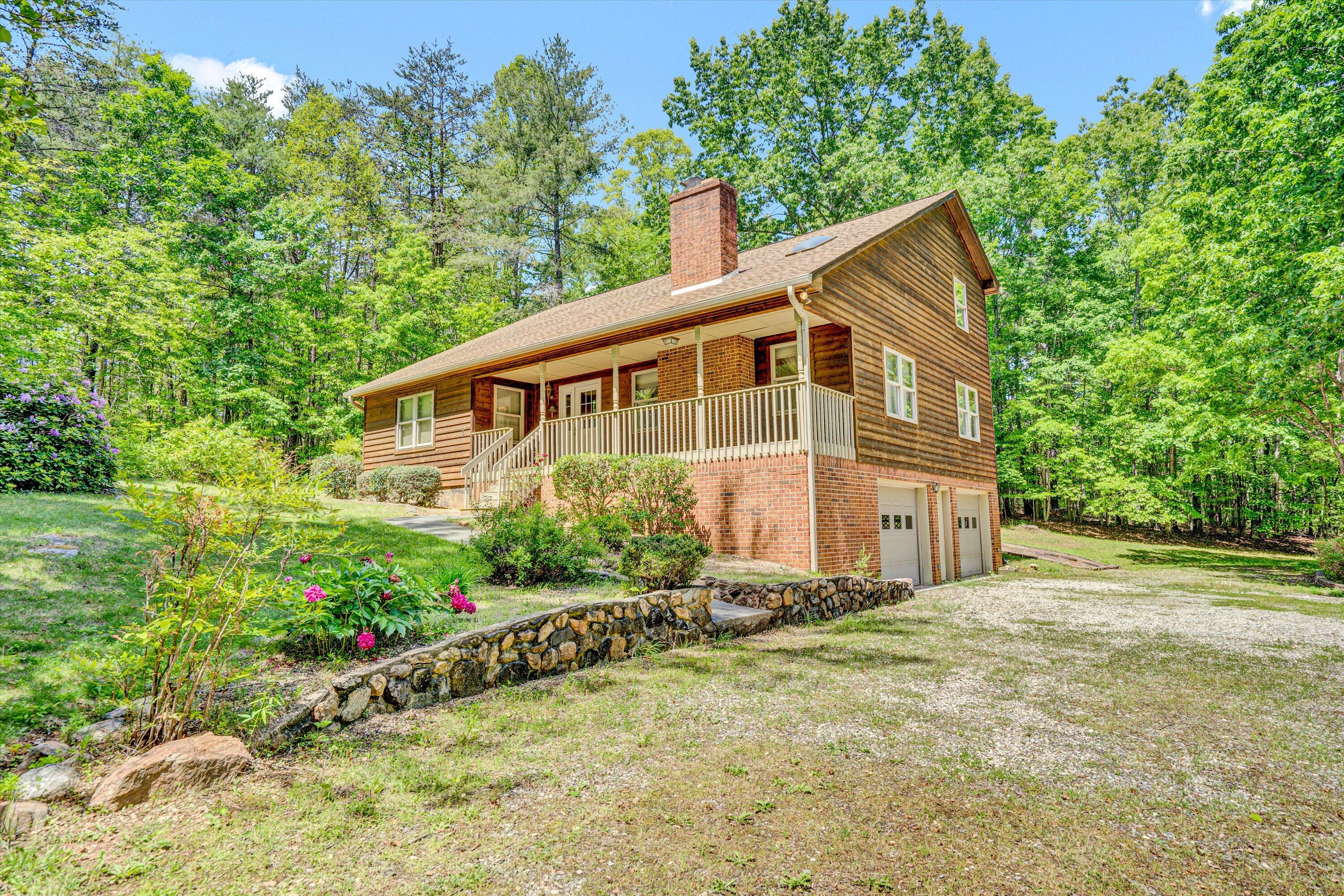 551 Heather Ridge Drive Rocky Mount, VA 24151 - Photo 3 of 41 a house with trees in the background