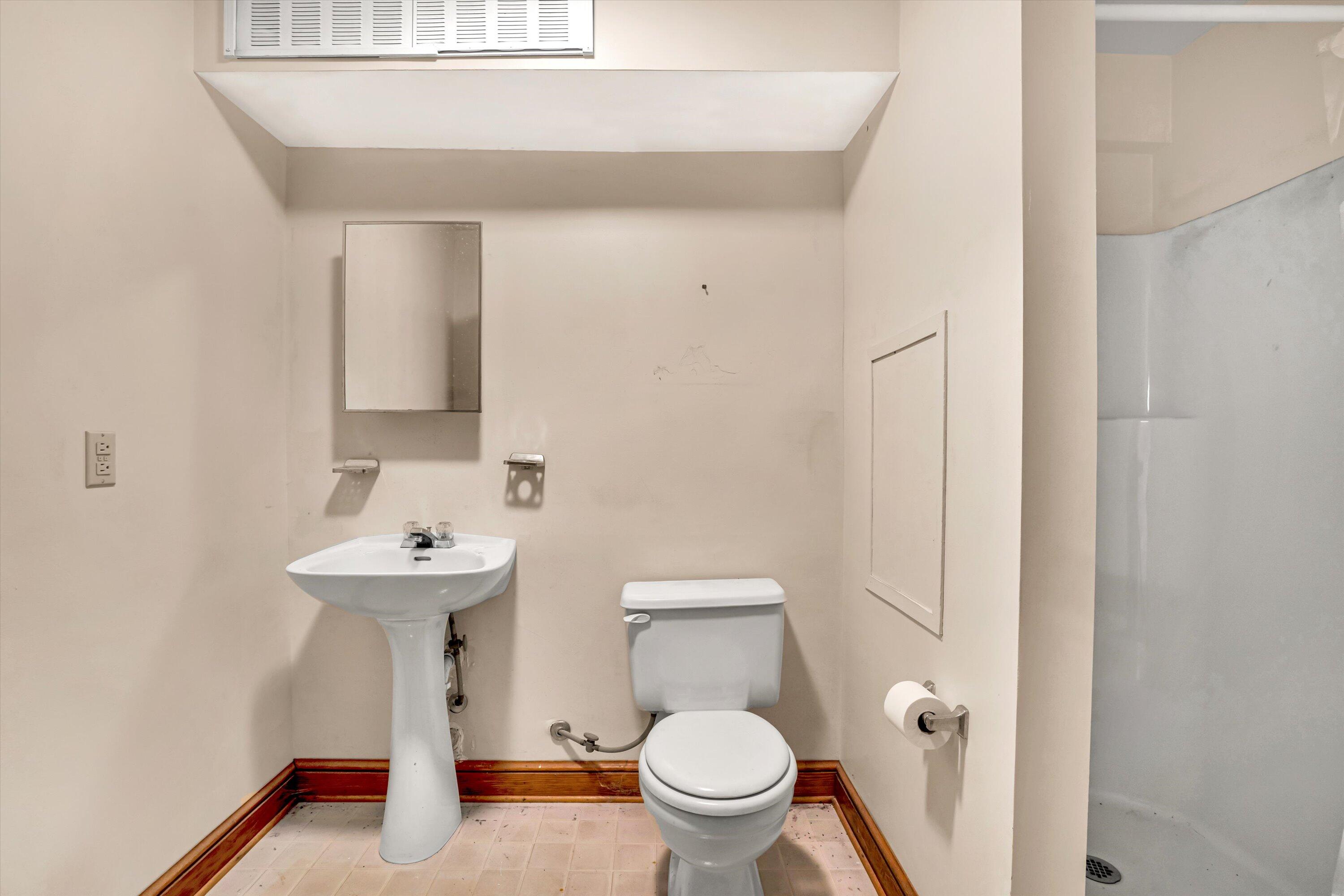 551 Heather Ridge Drive Rocky Mount, VA 24151 - Photo 33 of 41 a bathroom with a sink a toilet and a mirror