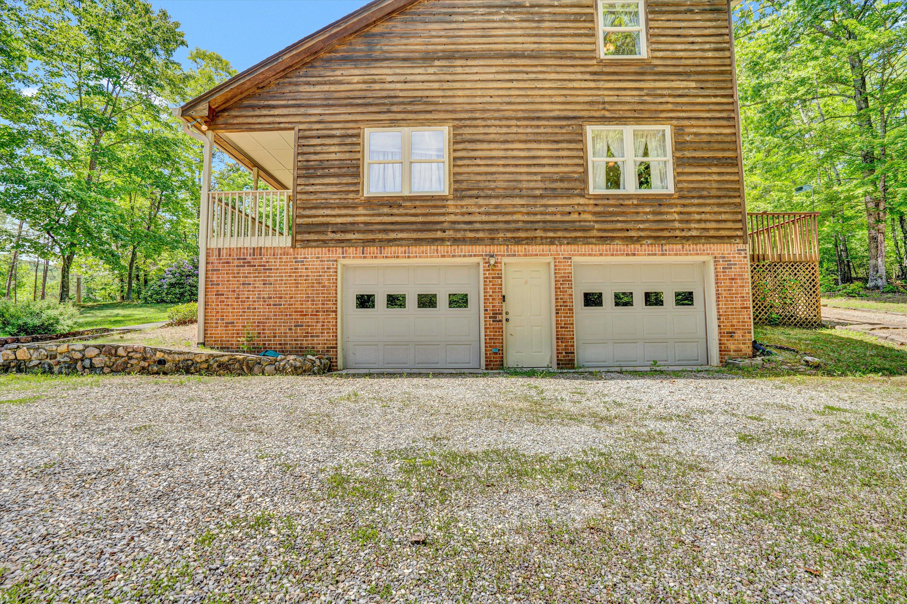 551 Heather Ridge Drive Rocky Mount, VA 24151 - Photo 4 of 41 a front view of a house with a yard and garage