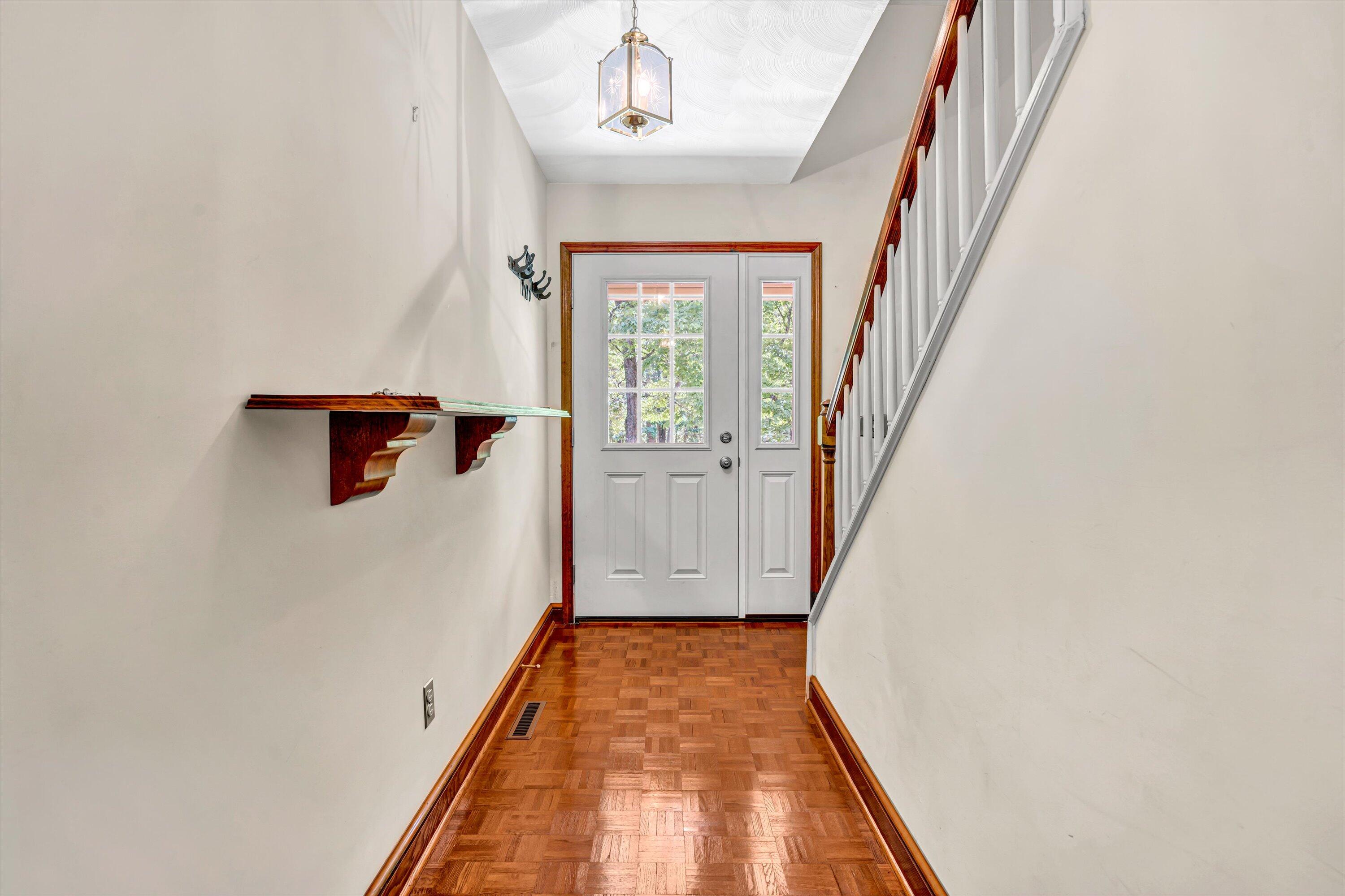 551 Heather Ridge Drive Rocky Mount, VA 24151 - Photo 7 of 41 a view of a hallway with wooden floor and staircase