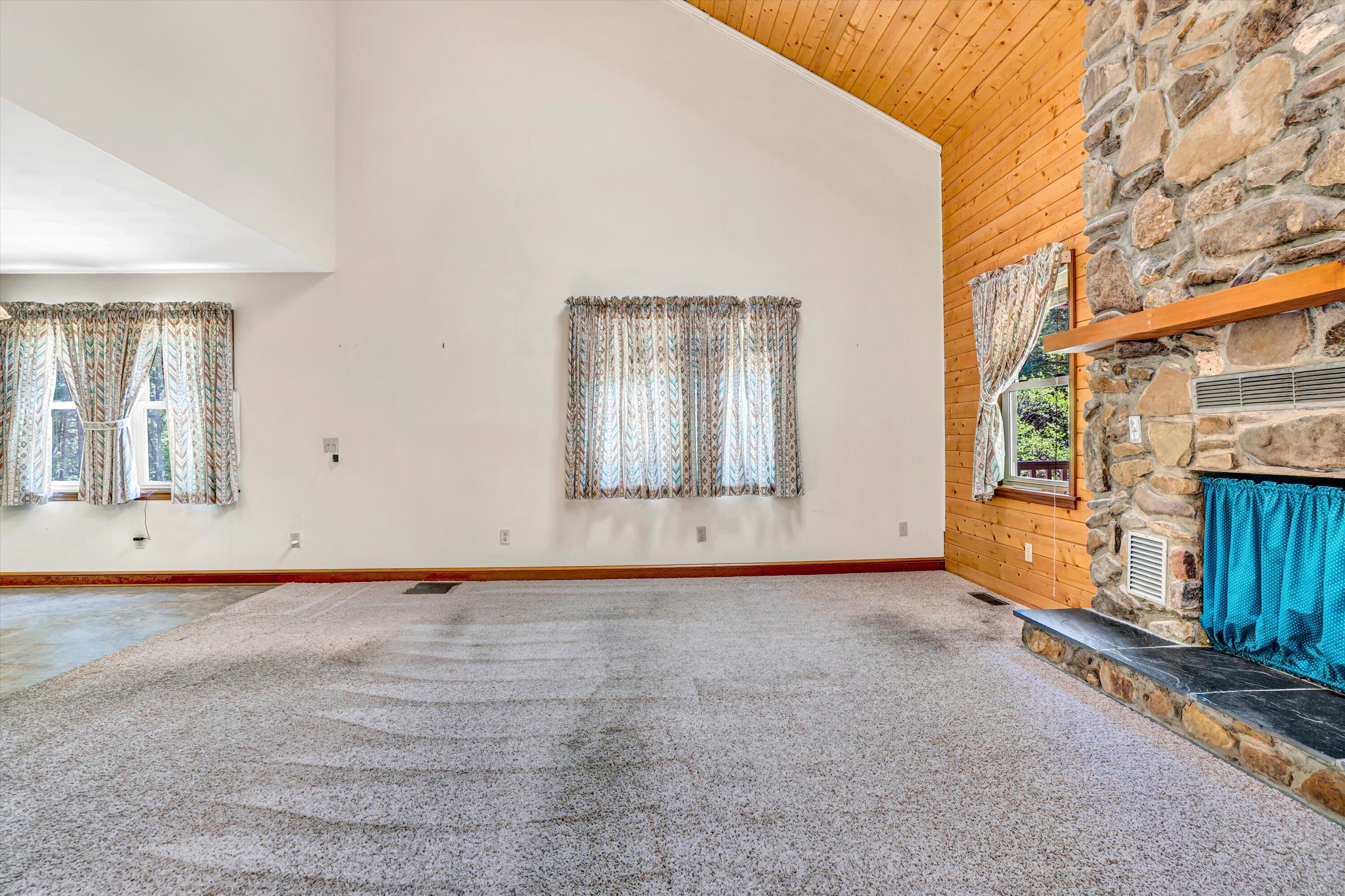 551 Heather Ridge Drive Rocky Mount, VA 24151 - Photo 9 of 41 an empty room with wooden floor and windows