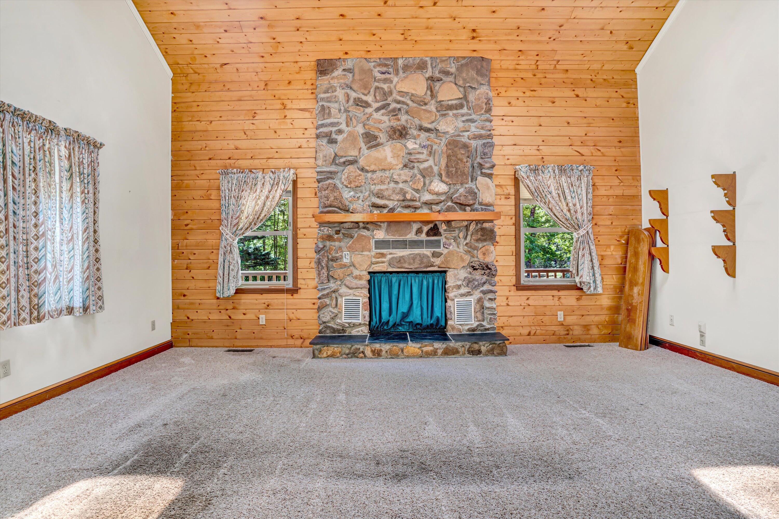 551 Heather Ridge Drive Rocky Mount, VA 24151 - Photo 10 of 41 a view of an empty room with a fireplace and a window